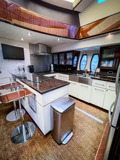Lovin Life Yacht Photos Pics Luxurious kitchen interior of 2008 Lazzara LSX 75 yacht with modern amenities.