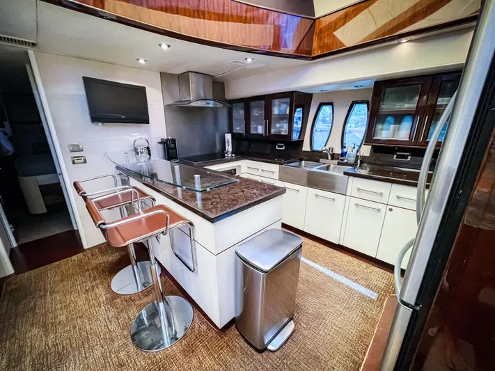Lovin Life Yacht Photos Pics Luxurious kitchen interior of 2008 Lazzara LSX 75 yacht with modern amenities.