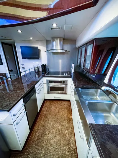 Lovin Life Yacht Photos Pics Luxurious kitchen interior of 2008 Lazzara LSX 75 yacht with modern appliances.