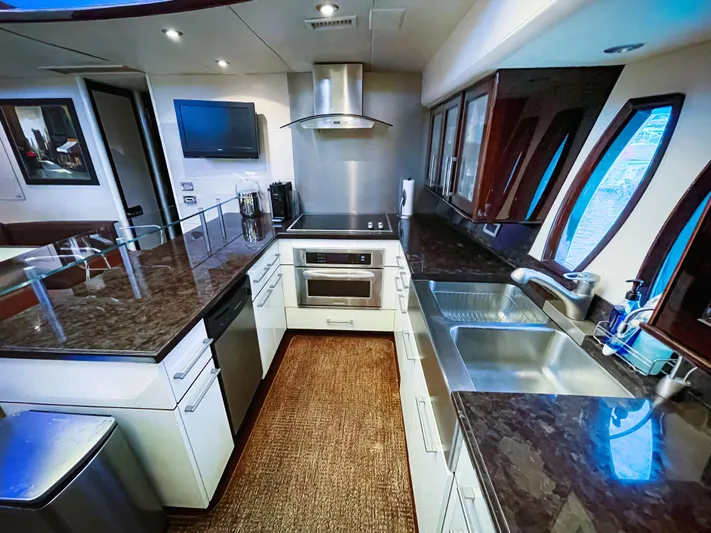 Lovin Life Yacht Photos Pics Luxurious kitchen interior of 2008 Lazzara LSX 75 yacht with modern appliances.