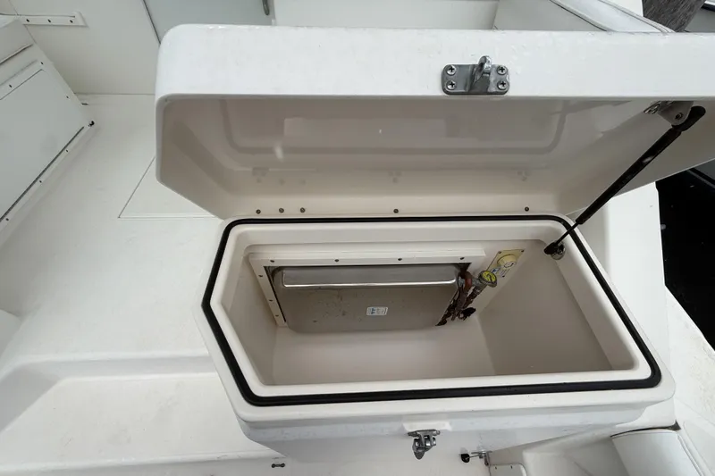 Panacea Yacht Photos Pics Open storage compartment on a 1998 Cabo 31 Express boat deck.