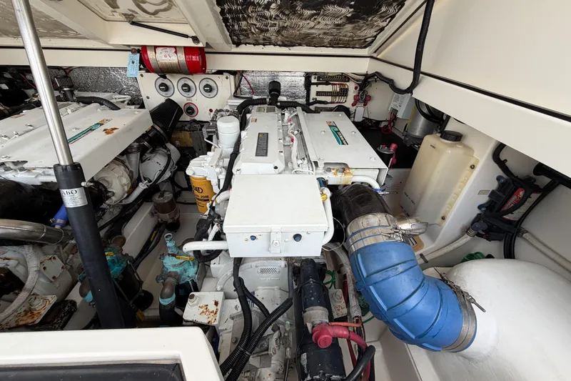 Panacea Yacht Photos Pics Engine room of a 1998 Cabo 31 Express boat, showcasing mechanical components and systems.