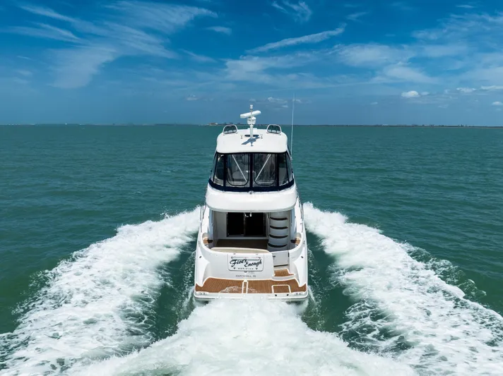  Yacht Photos Pics 2012 Meridian 441 Sedan cruising on open water under a clear blue sky.
