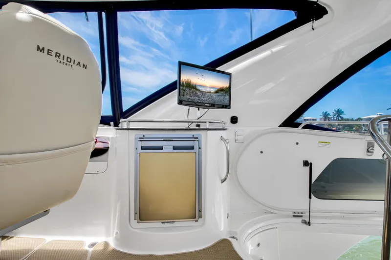  Yacht Photos Pics 2012 Meridian 441 Sedan yacht interior with seating, screen, and window view.