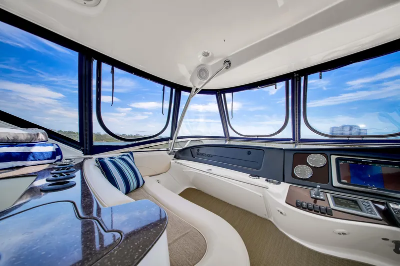  Yacht Photos Pics Luxurious interior of 2012 Meridian 441 Sedan yacht with panoramic windows and modern controls.