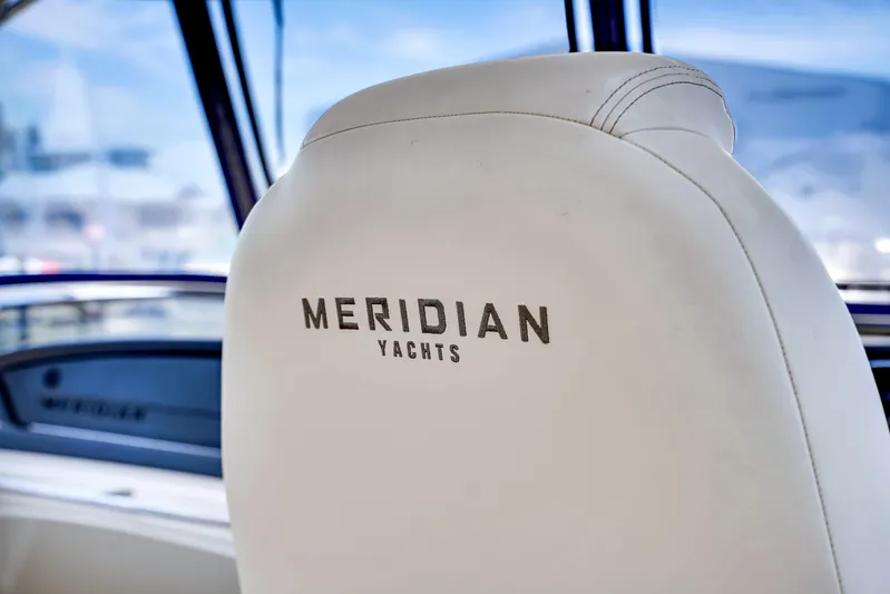 Yacht Photos Pics Meridian 441 Sedan 2012 yacht interior with branded seat, showcasing luxury design.