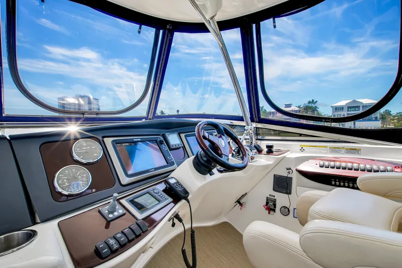  Yacht Photos Pics Interior of 2012 Meridian 441 Sedan yacht with modern navigation equipment and luxurious seating.