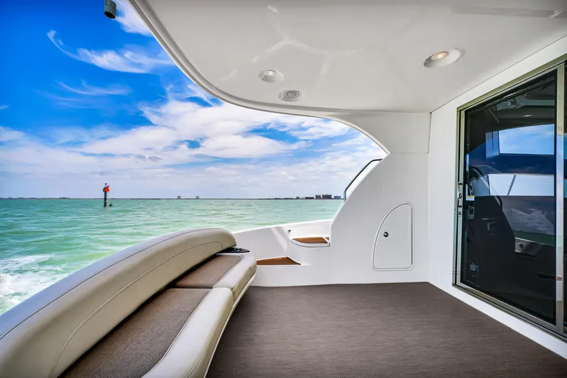  Yacht Photos Pics 2012 Meridian 441 Sedan yacht deck with ocean view and blue sky.