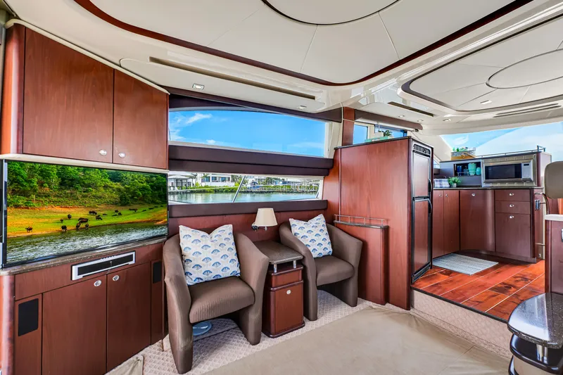  Yacht Photos Pics Luxurious interior of a 2012 Meridian 441 Sedan yacht with modern furnishings and scenic views.