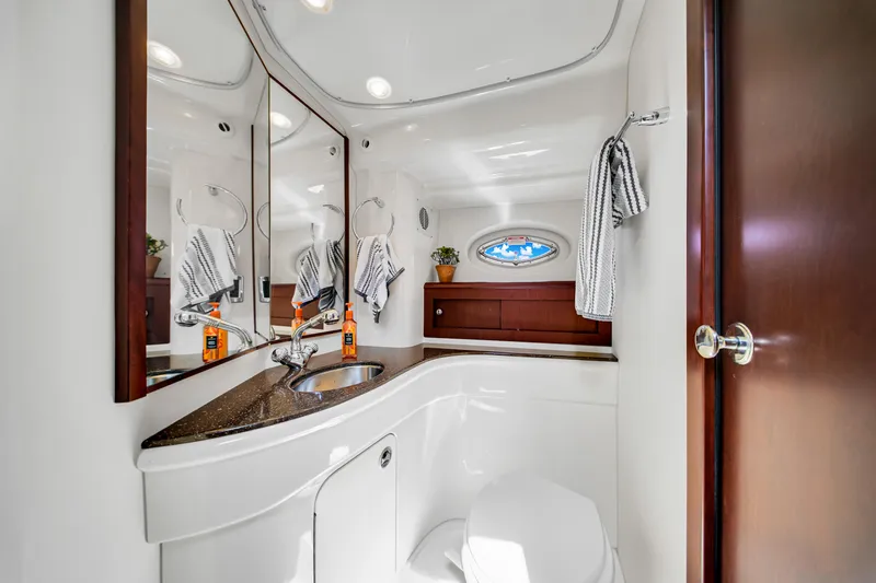  Yacht Photos Pics Luxurious bathroom in 2012 Meridian 441 Sedan yacht with modern fixtures and elegant design.