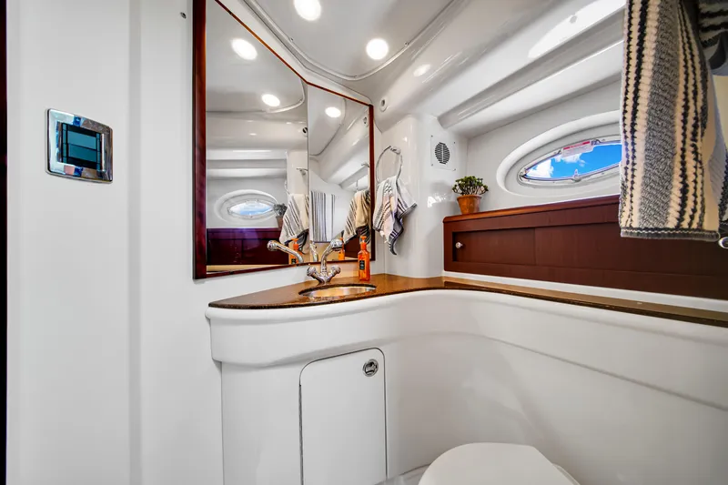  Yacht Photos Pics Luxurious bathroom interior of 2012 Meridian 441 Sedan yacht, featuring modern fixtures and elegant design.