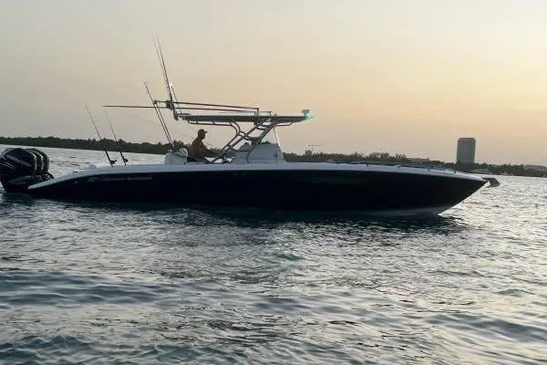  Yacht Photos Pics 2013 Midnight Express 39 Open boat cruising at sunset on calm waters.