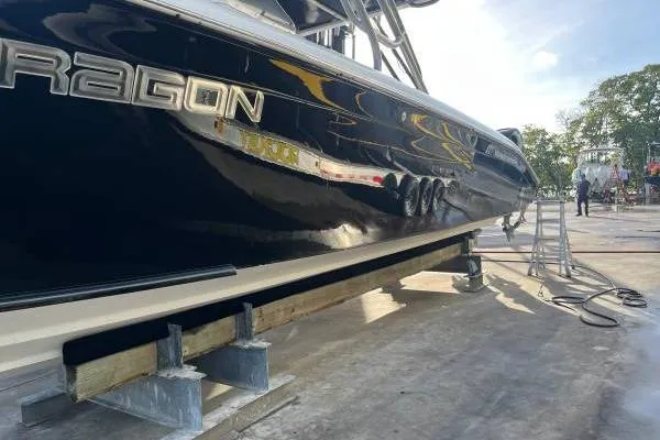  Yacht Photos Pics 2013 Midnight Express 39 Open boat on dry dock, side view.
