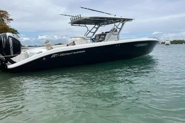 Yacht Photos Pics 2013 Midnight Express 39 Open boat on calm water, side view.