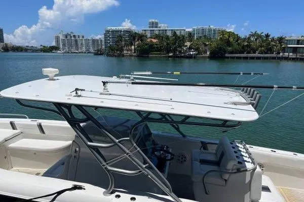 Yacht Photos Pics 2013 Midnight Express 39 Open boat docked with cityscape and water view.