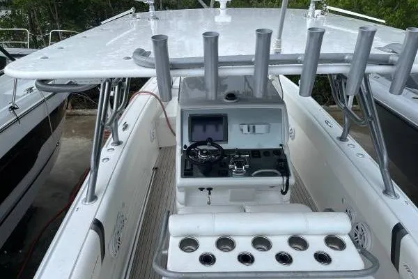  Yacht Photos Pics 2013 Midnight Express 39 Open boat cockpit with steering console and rod holders.