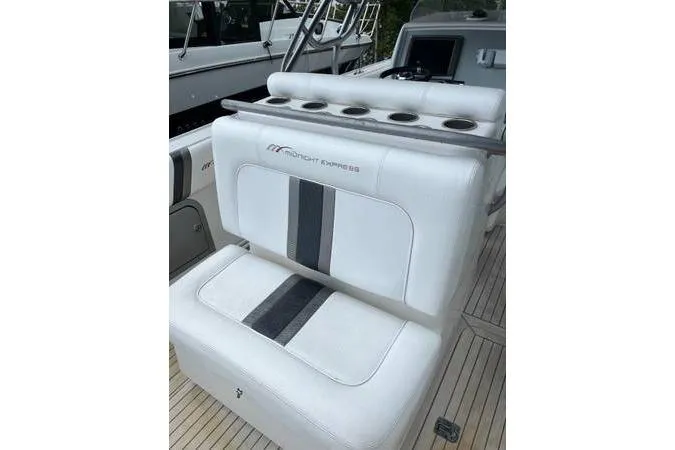  Yacht Photos Pics 2013 Midnight Express 39 Open boat seating with white upholstery and cup holders.
