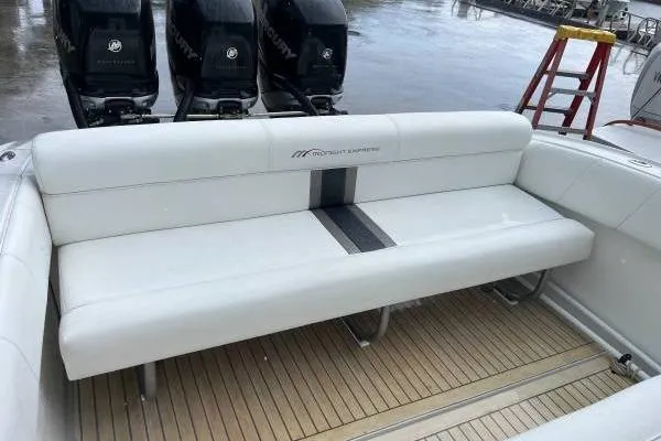  Yacht Photos Pics 2013 Midnight Express 39 Open boat with white seating and triple outboard engines.