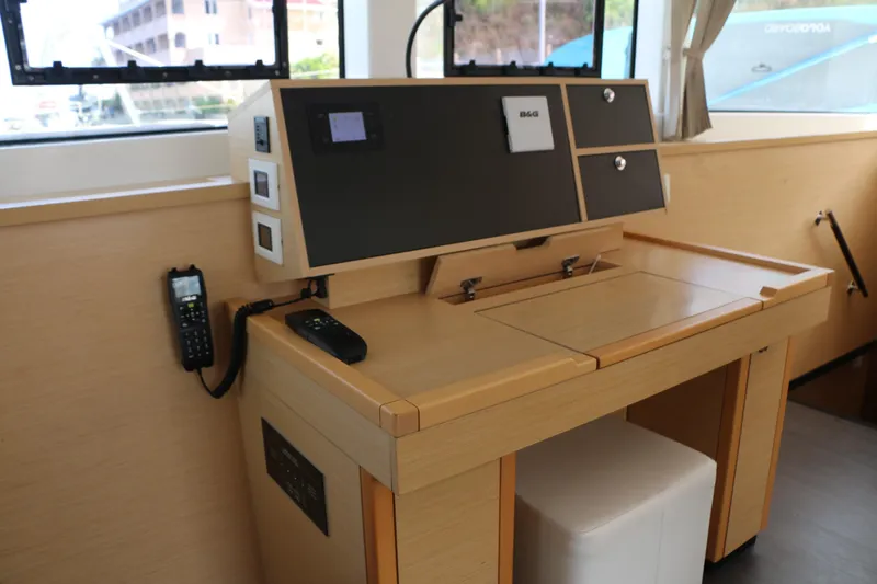 Nauti By Nature II Yacht Photos Pics Navigation station inside 2017 Lagoon 52 yacht, featuring control panel and communication equipment.
