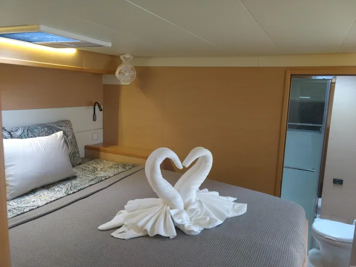 Nauti By Nature II Yacht Photos Pics Luxurious cabin interior of 2017 Lagoon 52 yacht with elegant swan towel art.
