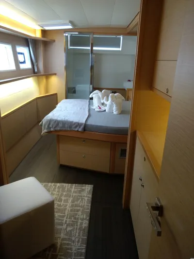 Nauti By Nature II Yacht Photos Pics Luxurious cabin interior of 2017 Lagoon 52 yacht with elegant bedding and modern design.