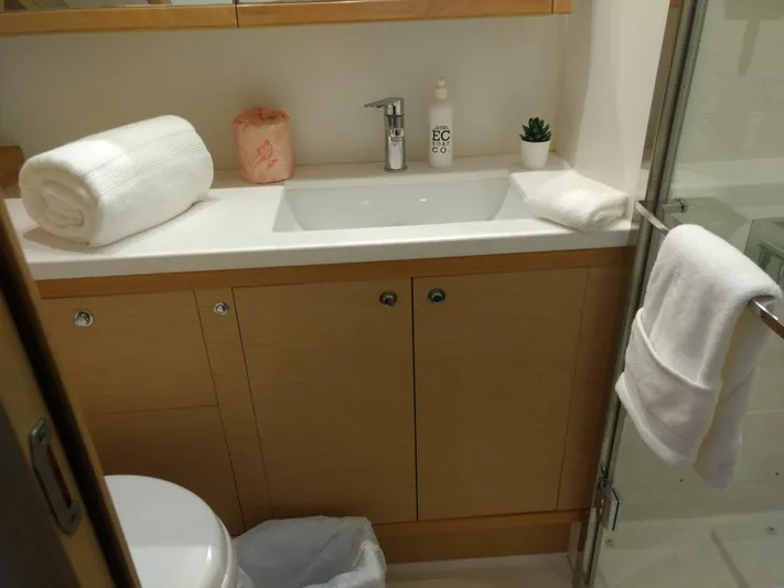 Nauti By Nature II Yacht Photos Pics Bathroom interior of 2017 Lagoon 52 yacht with sink, towels, and shower.