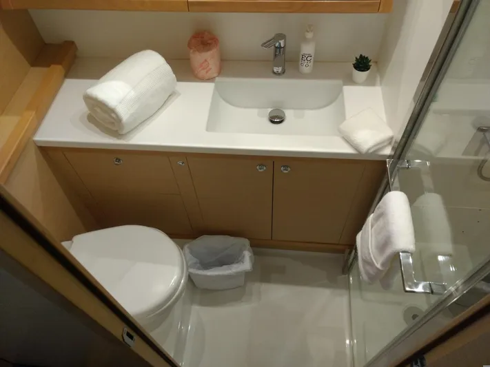 Nauti By Nature II Yacht Photos Pics Bathroom interior of 2017 Lagoon 52 yacht with sink, toilet, and shower.