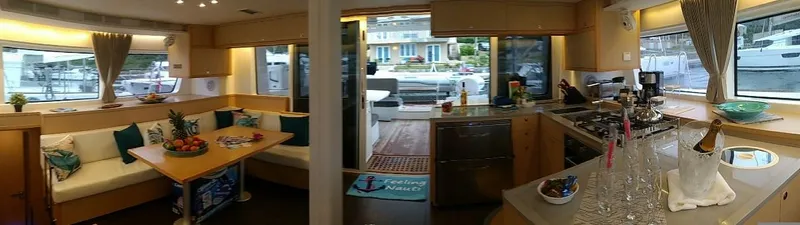 Nauti By Nature II Yacht Photos Pics Luxurious interior of a 2017 Lagoon 52 yacht with modern kitchen and seating area.