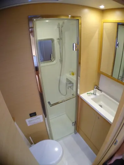 Nauti By Nature II Yacht Photos Pics Modern bathroom in 2017 Lagoon 52 yacht with shower, sink, and toilet.