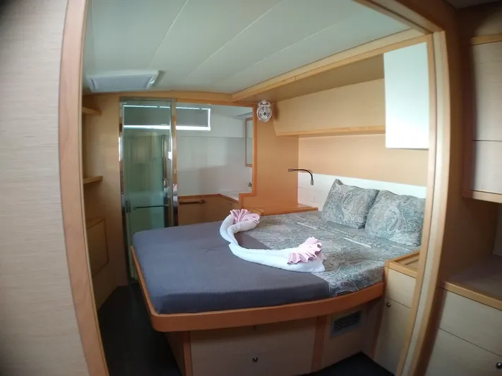 Nauti By Nature II Yacht Photos Pics Luxurious cabin interior of 2017 Lagoon 52 yacht with cozy bed and elegant decor.