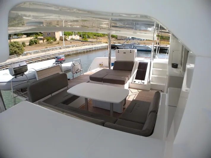 Nauti By Nature II Yacht Photos Pics Spacious deck of 2017 Lagoon 52 catamaran with comfortable seating and table.