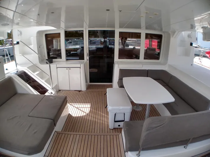 Nauti By Nature II Yacht Photos Pics Spacious deck of 2017 Lagoon 52 catamaran with seating and table.