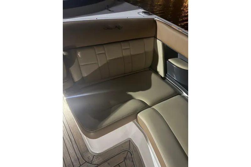  Yacht Photos Pics 2015 Sea Ray 350 SLX boat interior with tan leather seating at night.