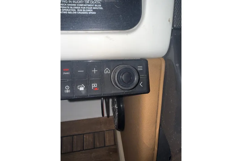  Yacht Photos Pics Control panel of a 2015 Sea Ray 350 SLX boat with various buttons and dials.