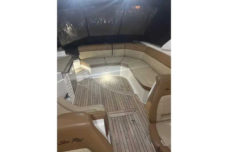  Yacht Photos Pics Luxurious interior of 2015 Sea Ray 350 SLX boat with elegant seating and wood flooring.