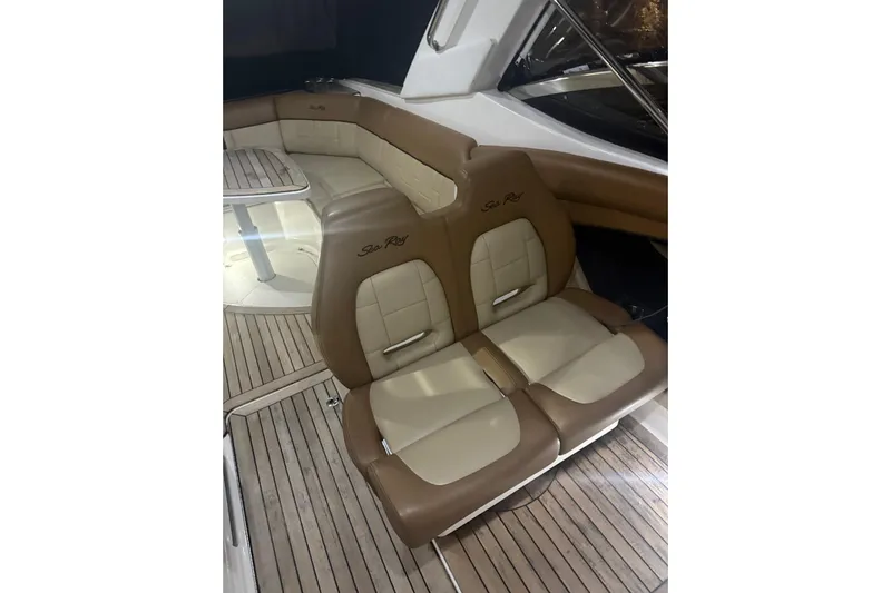  Yacht Photos Pics 2015 Sea Ray 350 SLX interior with tan leather seating and wooden flooring.