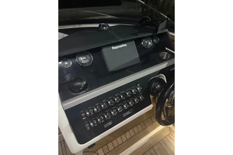  Yacht Photos Pics Control panel of a 2015 Sea Ray 350 SLX boat with Raymarine display.