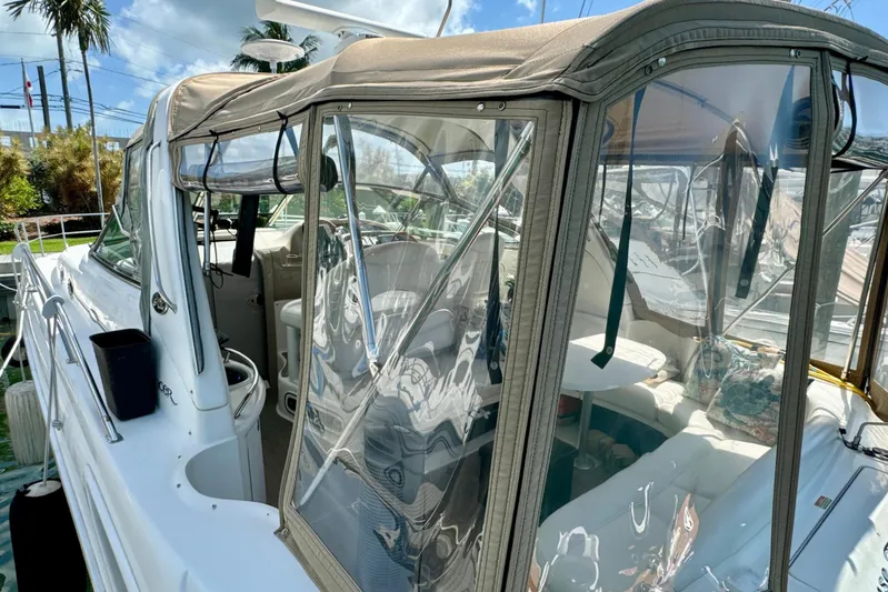 Seaswing Yacht Photos Pics 2002 Sea Ray 380 Sundancer yacht with enclosed cockpit at marina.