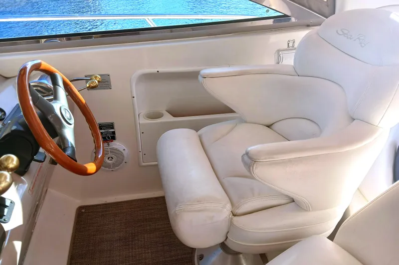 Seaswing Yacht Photos Pics Captain's chair and steering wheel on a 2002 Sea Ray 380 Sundancer yacht.