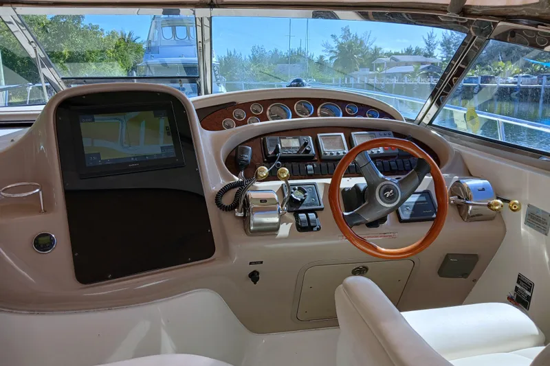 Seaswing Yacht Photos Pics Helm of 2002 Sea Ray 380 Sundancer with navigation system and controls.