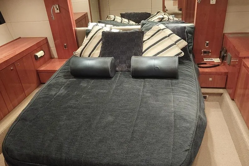 Albacore Yacht Photos Pics Luxurious cabin interior of 2012 Sunseeker Portofino 48 yacht with plush bedding.