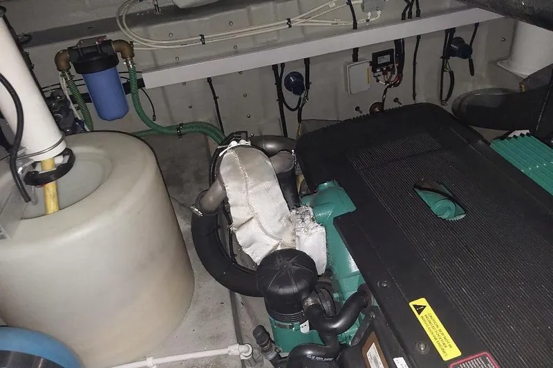 Albacore Yacht Photos Pics Engine room of a 2012 Sunseeker Portofino 48 yacht, showcasing mechanical components.