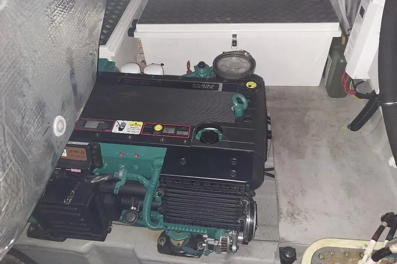 Albacore Yacht Photos Pics Engine compartment of a 2012 Sunseeker Portofino 48 yacht, showcasing mechanical components.