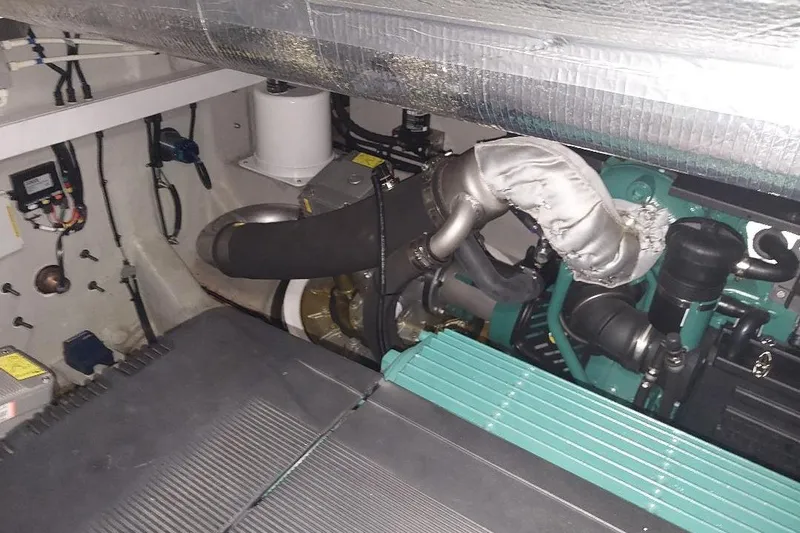 Albacore Yacht Photos Pics Engine room of 2012 Sunseeker Portofino 48 yacht, showcasing mechanical components.