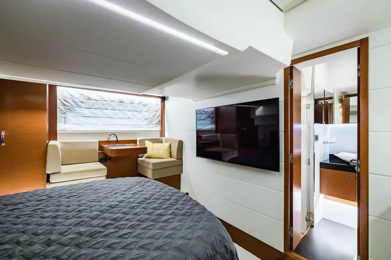  Yacht Photos Pics Luxurious interior of 2013 Prestige 500 Fly yacht with modern bedroom and ensuite bathroom.