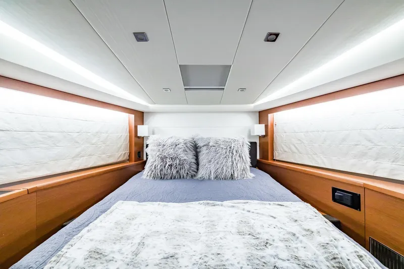  Yacht Photos Pics Luxurious bedroom interior of 2013 Prestige 500 Fly yacht with plush bedding and modern lighting.