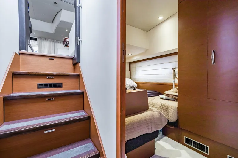  Yacht Photos Pics Interior of 2013 Prestige 500 Fly yacht, featuring stairs and cozy bedroom.