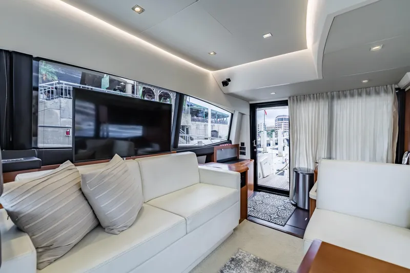  Yacht Photos Pics Luxurious interior of 2013 Prestige 500 Fly yacht with modern furnishings and large windows.