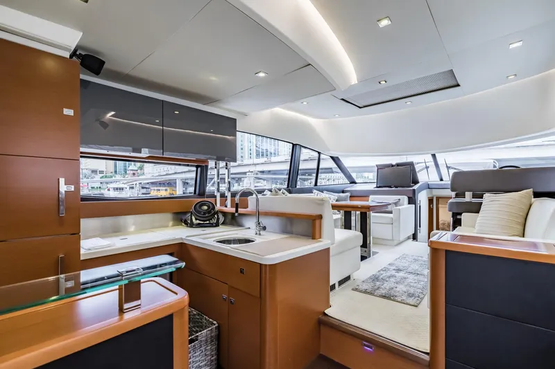  Yacht Photos Pics Luxurious interior of 2013 Prestige 500 Fly yacht with modern kitchen and seating area.