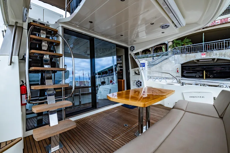  Yacht Photos Pics Prestige 500 Fly 2013 yacht interior with wooden stairs and seating area.